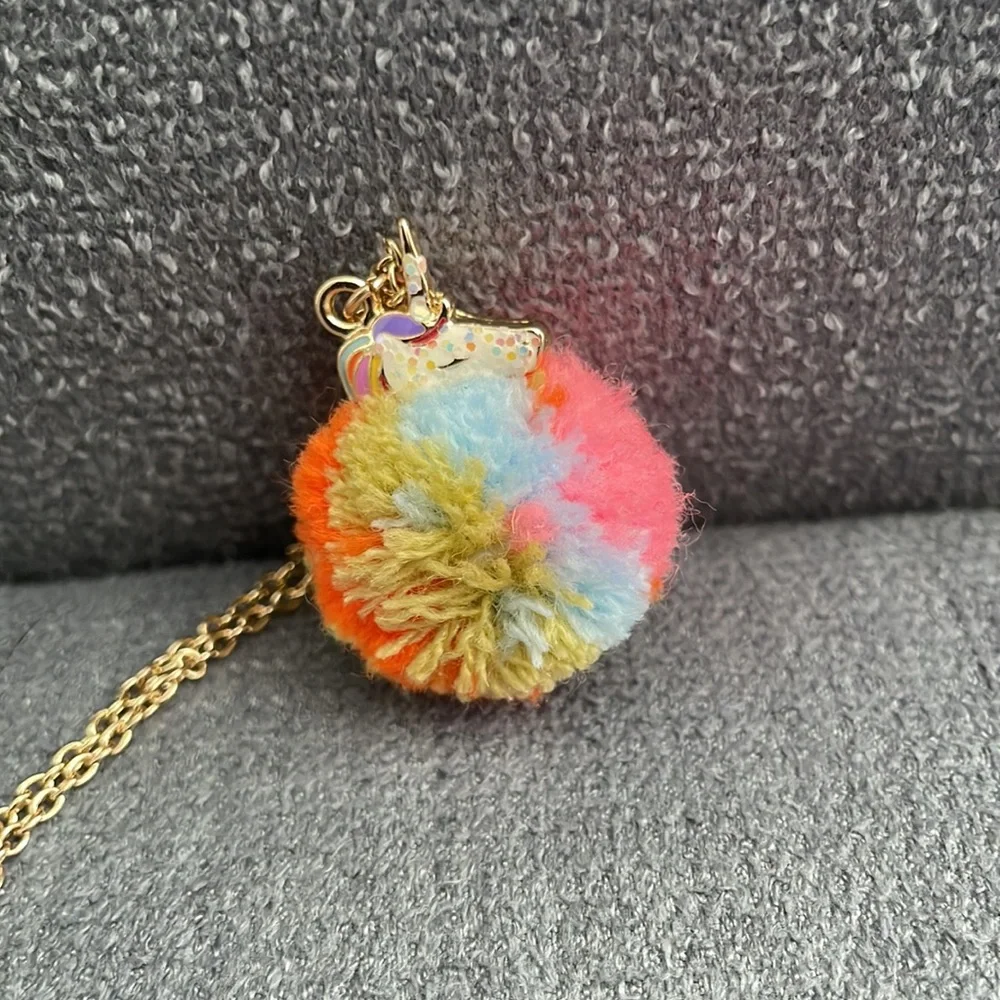 Claire’s Rainbow Unicorn PomPom Necklace